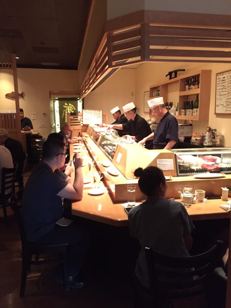 Diners at the sushi bar