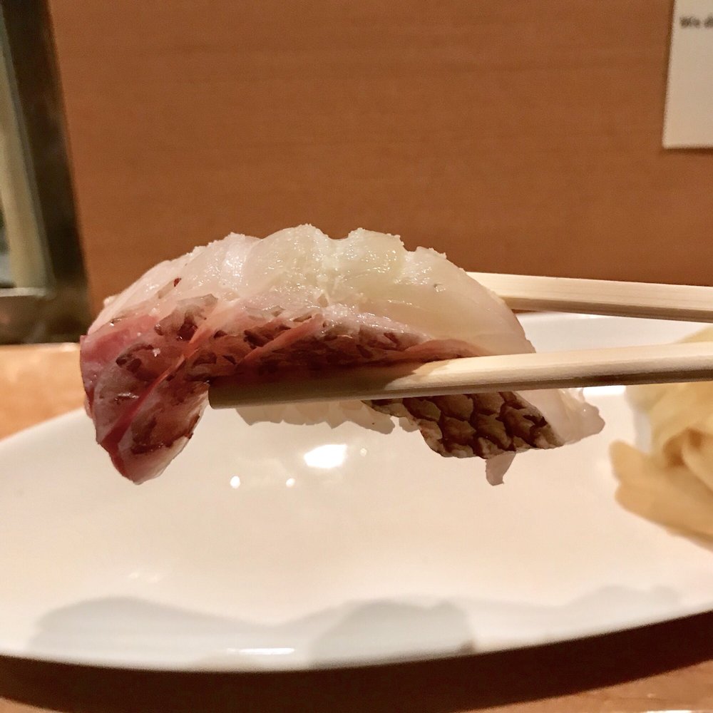 Nigiri held with chopsticks